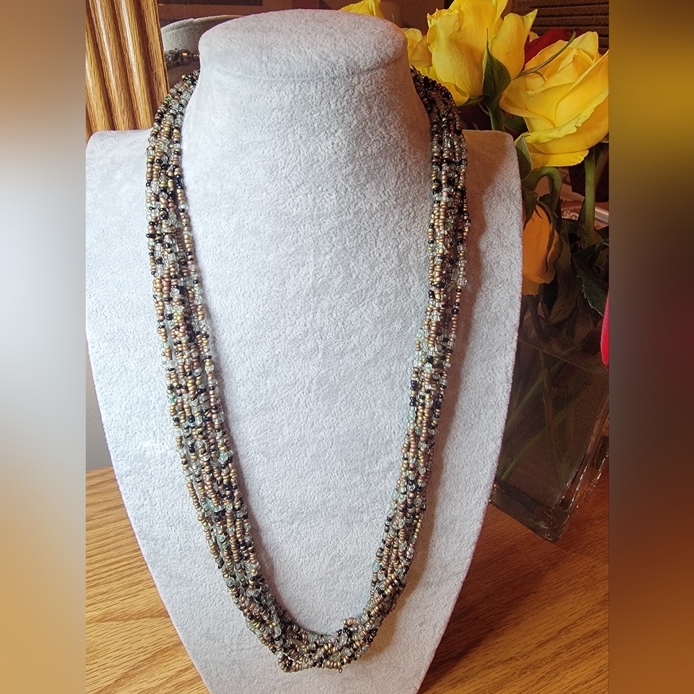 Glass Seed Bead Necklace 10 Strands Twist at the Bottom.